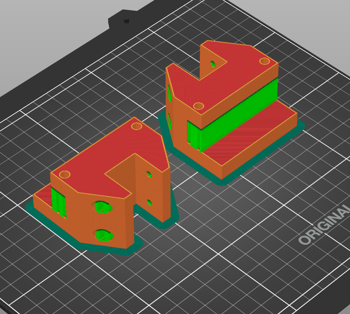 PrusaSlicer preview of two orange adjusted mounting or support components with green support material