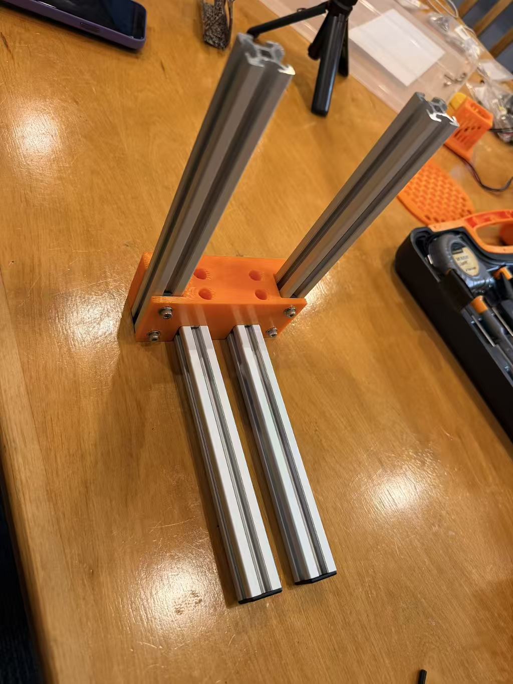 Orange printed connector joining four aluminium extrusions during EntoSieve frame assembly