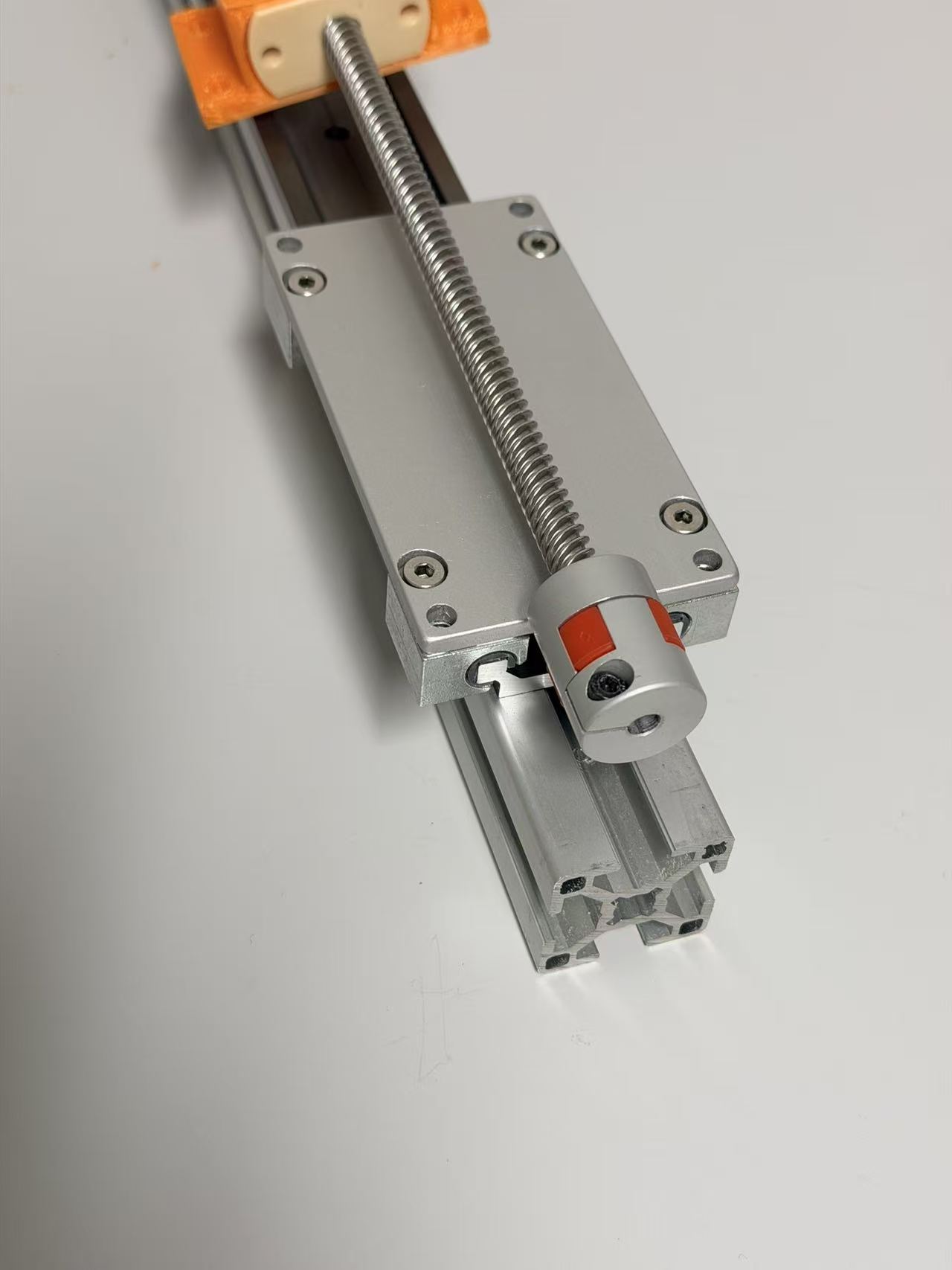 Close-up of the EntoSieve lead screw, shaft coupling and linear stage during assembly